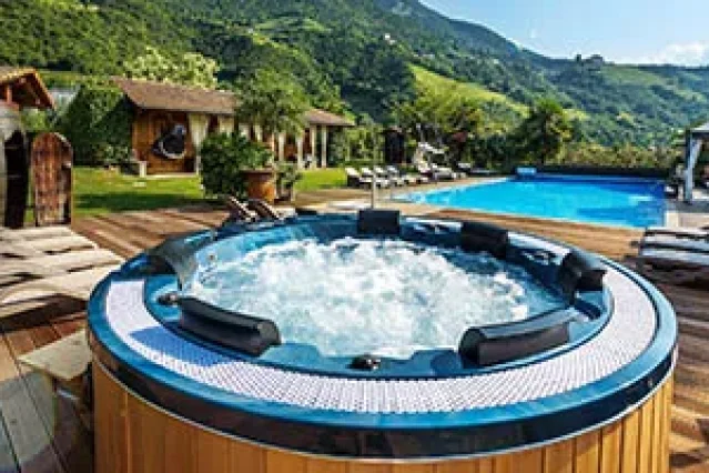 Hot tub in a hotel with a hillside view